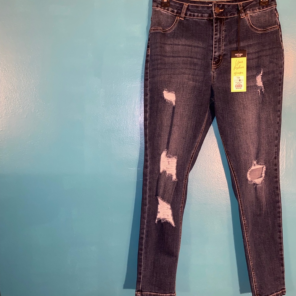 Distressed blue denim skinny jeans. Never worn.